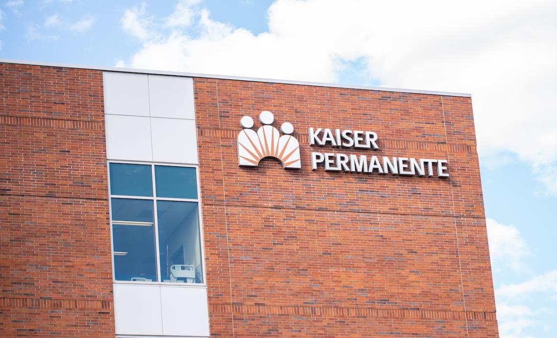 For more than a decade, Kaiser Permanente has been under the microscope for shortcomings in mental health care, even as it is held in high esteem on the medical side. In 2013, California regulators fined the insurer $4 million for failing to reduce wait times, giving patients inaccurate information, and improperly tracking appointment data. And in 2023, KP agreed to pay $50 million, the largest penalty ever levied by the state’s Department of Managed Health Care, for failing to provide timely care, maintain a sufficient number of mental health providers, and oversee its providers effectively. Now, Kaiser Permanente is back in the hot seat as mental health workers in Southern California wage a strike that’s in its fourth month. KP therapists and union representatives accuse the HMO giant of saddling workers with excessive caseloads and often forcing patients to wait twice as long as the state allows for follow-up appointments. They say that the staff is burned out and that this work environment makes it hard to recruit clinicians, exacerbating the staffing problem. KP rebuffs these claims, saying the union is parading out old problems, seeking to create “an inaccurate and outdated perception” of KP’s care. They say the union’s pay demands are “in direct contrast to our commitment to providing quality, affordable care.” Kaiser Permanente — the largest commercial health plan in California, with about 9 million members — is far from alone in struggling to provide adequate mental health care. A pandemic-induced shortage of health care workers has created obstacles for all health plans in recent years, on top of a preexisting scarcity. Moreover, many therapists decline to contract with insurers. And lingering bias in the health care system against mental health services — and patients — may also be at play. Email Sign-Up Subscribe to KFF Health News’ free Morning Briefing. Federal and state laws require health plans to provide mental health care on par with medical care. But many people who have sought therapy can vouch that those measures, known as mental health parity laws, do not seem to be followed consistently. You can spend hours or even days calling every therapist allegedly in your insurance company’s network and come away empty-handed. Secret-shopper surveys of 4,300 randomly selected outpatient providers listed as accepting new patients showed that “an alarming proportion” of them were unresponsive or unreachable, according to a federal government report issued last month. And while that was true for medical providers, it was consistently worse for mental health and substance abuse care, according to the report. In California, state regulators have been conducting behavioral health care investigations of the insurance companies they regulate to help identify the extent and causes of delays in care. So far, the DMHC has investigated nine health plans (not including KP) and found dozens of violations related to appointment availability, timely access, quality of care, and patient appeals, department spokesperson Rachel Arrezola says. The agency also has identified numerous “barriers” that do not necessarily break the law but may make it more difficult for patients to get care, she says. Mark Peterson, a professor at UCLA’s Luskin School of Public Affairs, notes that the open-ended nature of therapy can conflict with health plans’ focus on their bottom lines. “It may be once a week, it may be more than once a week and go on for years,” Peterson says. For insurers, he says, the question is, “How do you put an appropriate limit on that?” And the unwillingness of many therapists to accept insurance companies’ payment rates, or to abide by their restrictions, often leads them to decline participation in health plan networks and charge higher rates. That, Peterson says, makes therapy financially inaccessible for a lot of people seeking it. Even if you have some coverage for therapy outside your health plan network, your insurer will pay only a percentage of the rate that it recognizes as legitimate. “If your therapist is charging $300 an hour, and your insurance company only recognizes $150 an hour, and they only pay 50% of what they recognize, now you’ve got a quarter coverage of your therapy,” Peterson says. Since Kaiser Permanente is a closed system and patients don’t get reimbursed for care outside the network, access problems for its patients can be “highly pronounced,” Peterson adds. In California, KP has accounted for over $54 million of the $55.7 million in mental-health-related fines the DMHC has levied on insurers in the past two decades. That includes the $50 million fine imposed in 2023, which was part of a settlement in which KP agreed to fix deficiencies the department found and to invest an additional $150 million in projects intended to enhance access to mental health care, not just for KP members, around California. Officials at the National Union of Healthcare Workers, which represents some 2,400 KP mental health workers in the ongoing Southern California contract talks, say the HMO could easily invest enough to become a paragon of high-quality mental health care if it wanted to. Greg Tegenkamp, the lead union negotiator, says KP could “lead the way to do the right thing.” Kaiser Permanente says it already is doing the right thing, even as it acknowledges past shortcomings. In a recent statement, it said it has invested over $1 billion in new treatment spaces and more mental health providers since 2020. “We’ve grown our workforce and increased our network of skilled therapists so that any Kaiser Permanente member who needs an appointment is able to get timely, high-quality, clinically appropriate care,” the company says. In addition to higher wages and lower patient loads, workers want more time to complete follow-up tasks outside sessions and the reinstatement of a pension that was eliminated for those hired in Southern California after 2014. Kaiser Permanente says that it already pays its mental health workers in Southern California about 18% above the market rate and that the current proposal would raise pay even more. KP recently raised its proposed wage increase by a modest amount, according to union officials. KP refutes reports from workers about long wait times for patients seeking mental health appointments. It says the average wait time is 48 hours for urgent appointments and six business days for nonurgent ones, “which is better than the state’s requirement” of no more than 10 days. But workers say KP patients still face long delays for follow-up appointments. “It’s really hard for our patients to get regular, frequent appointments,” says Kassaundra Gutierrez-Thompson, a KP therapist in Southern California who is on strike. Gutierrez-Thompson says she’s seen it from both sides, since she is also a patient who sees a KP psychiatrist for depression and recently faced a big rescheduling delay after one of her appointments was canceled without notice. A photo of Kassaundra Gutierrez-Thompson posing for a photo with her fellow workers on strike. She holds a sign that reads, Kassaundra Gutierrez-Thompson of Los Angeles is one of the Kaiser Permanente therapists on strike in Southern California. She also sees a KP psychiatrist and says she’s seen how working conditions affect staffers and patients alike. It’s “like a factory,” Gutierrez-Thompson says. “They would love for us to be robots with no needs and just see patients all day.”(Ignacio Vázquez Cano) As a provider, Gutierrez-Thompson says, she and her colleagues are expected to see patients “back-to-back-to-back.” She says some of her colleagues developed urinary tract infections when they couldn’t get to the bathroom. One even started wearing adult diapers, she says. “The working conditions are like a factory,” Gutierrez-Thompson says. “We do such human work, but they would love for us to be robots with no needs and just see patients all day.” This article was produced by KFF Health News, which publishes California Healthline, an editorially independent service of the California Health Care Foundation.